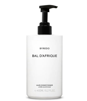 Byredo Bal d'Afrique shampoo lather texture in palm demonstrating gentle cleansing and soft foam