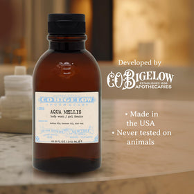 C. O. Bigelow bottle in hand showing 10.5 fl oz scale and portability
