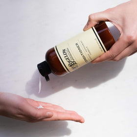 C. O. Bigelow conditioner in hand demonstrating amount for detangling ease
