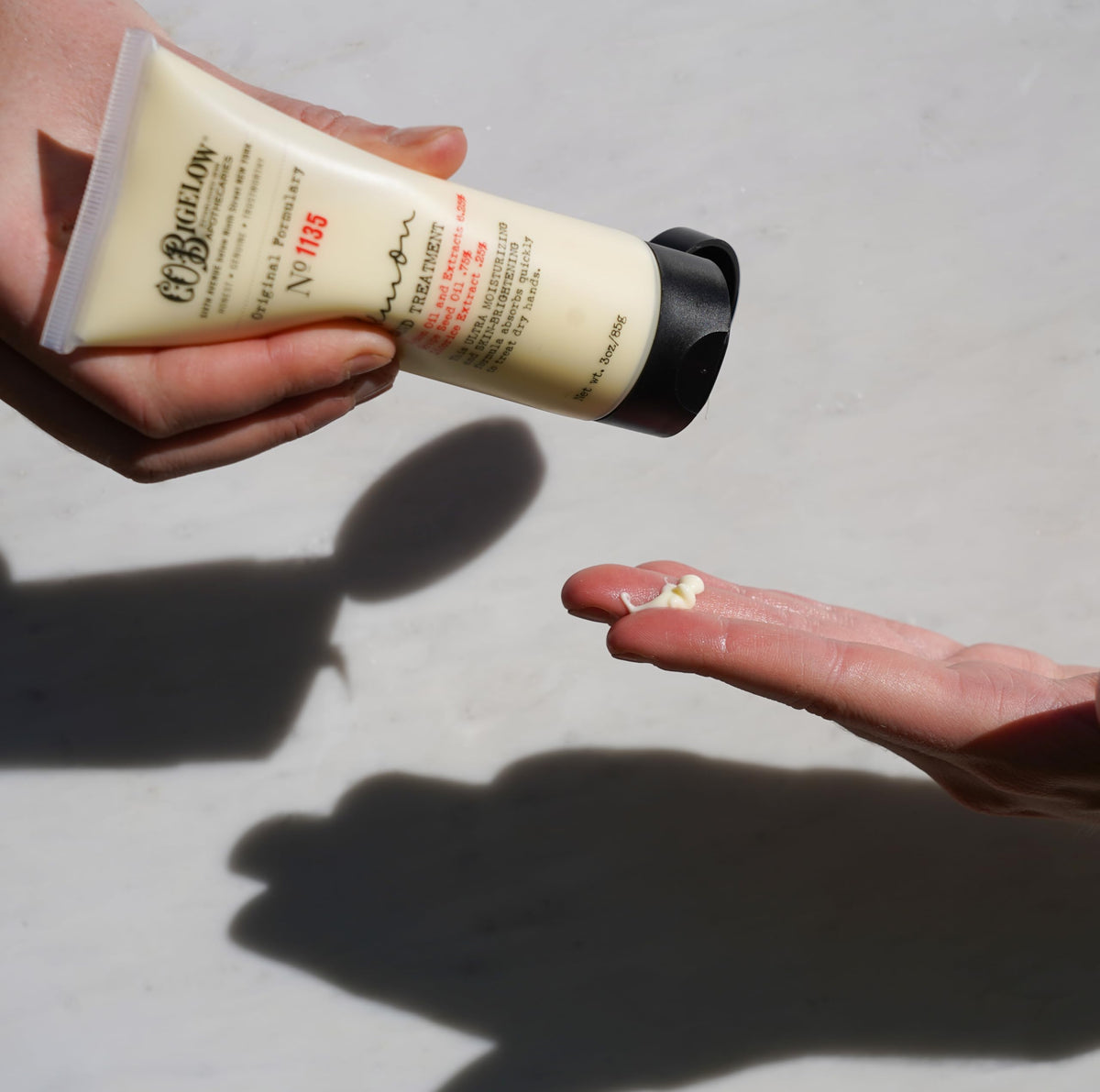 C. O. Bigelow product in hand showing easy application and non-greasy finish