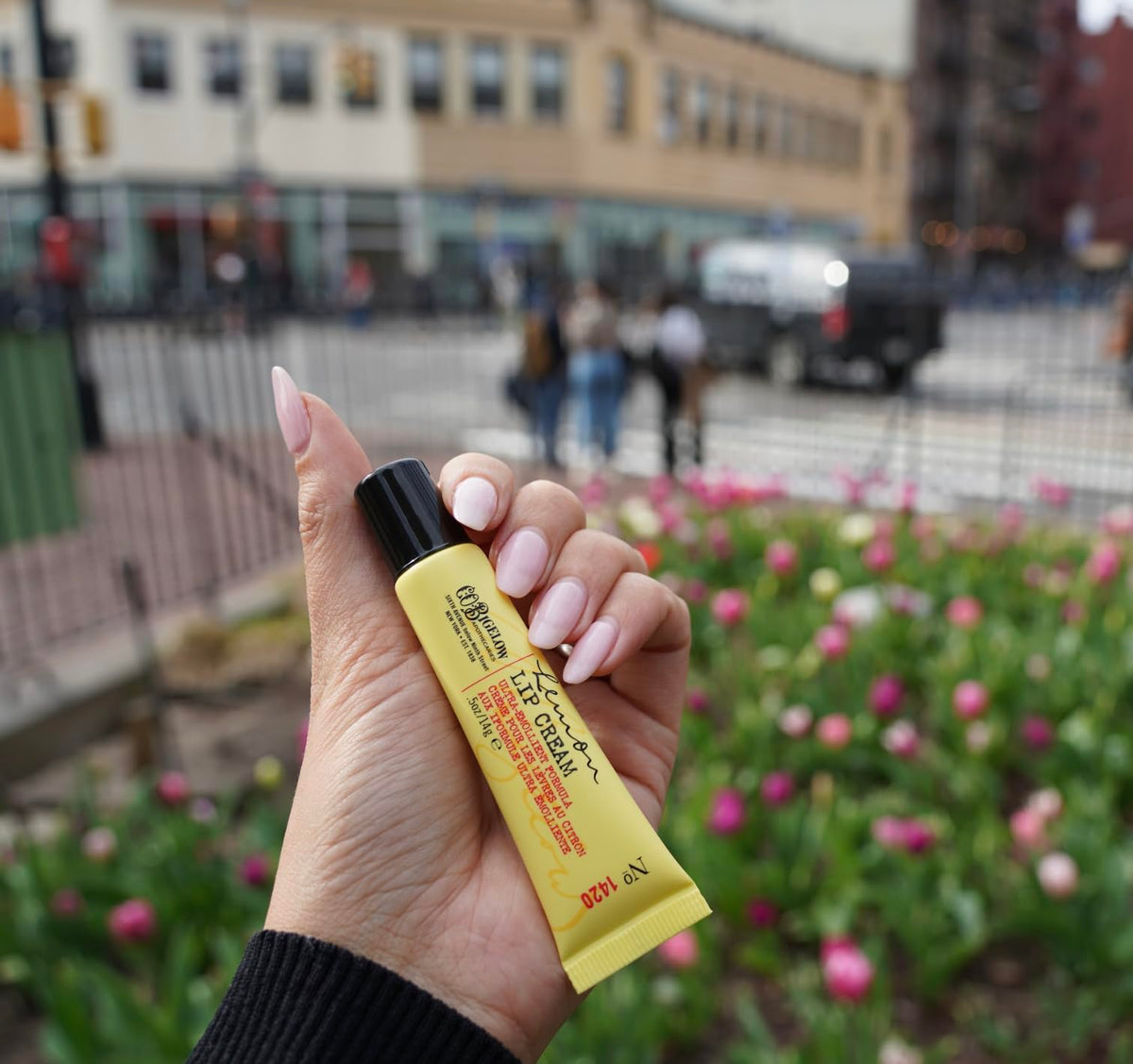 C. O. Bigelow balm being applied to lips for instant soothing and hydration