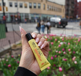 C. O. Bigelow balm being applied to lips for instant soothing and hydration
