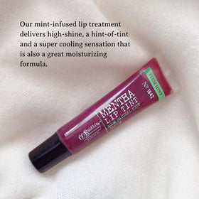 C.O. Bigelow gloss texture swatched to show sheer plum tint and glossy finish