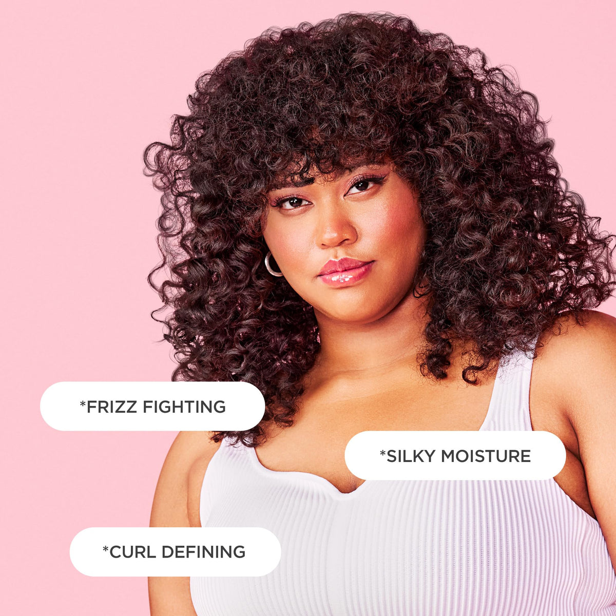 Cake Beauty applying curl cream to wet curls, defines and reduces frizz