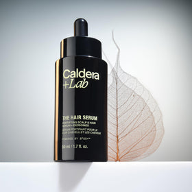 Caldera + Lab applying serum to scalp in use benefit: promotes fuller looking hair