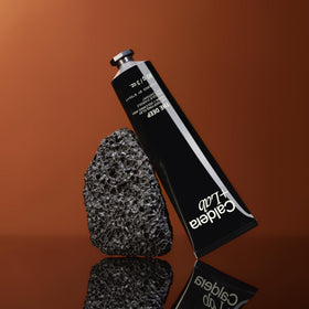 Caldera + Lab jar beside hand showing size and ease-of-use benefit