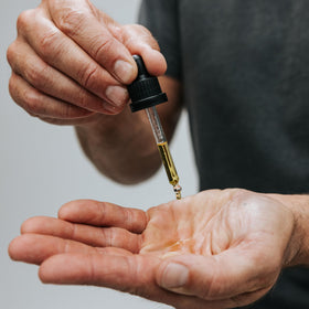 Caldera + Lab applying serum to skin showing smooth finish and nourishment