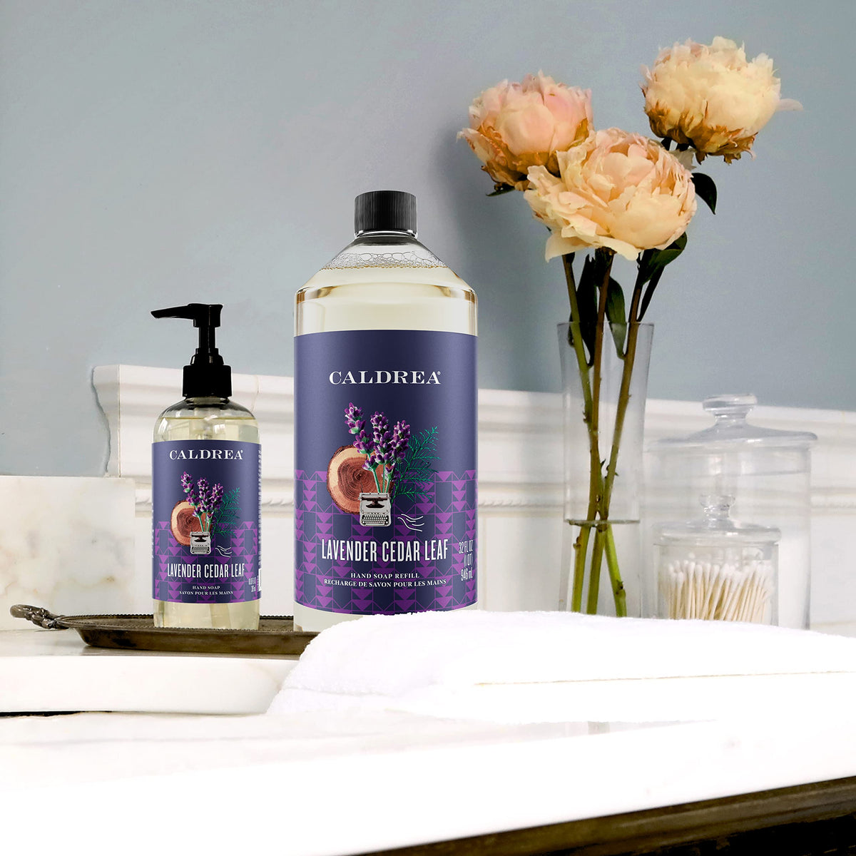 Caldrea bottle beside olive oil and aloe showing nourishing ingredients benefit