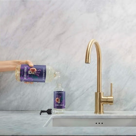 Caldrea pouring refill close-up demonstrating easy transfer and reduced waste