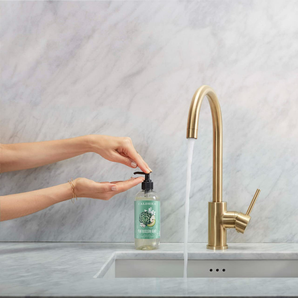 Caldrea pump dispenser close-up demonstrating easy one-handed use and precise dosing