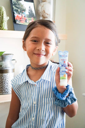 California Baby pump action in hand demonstrating easy, mess-free application benefit
