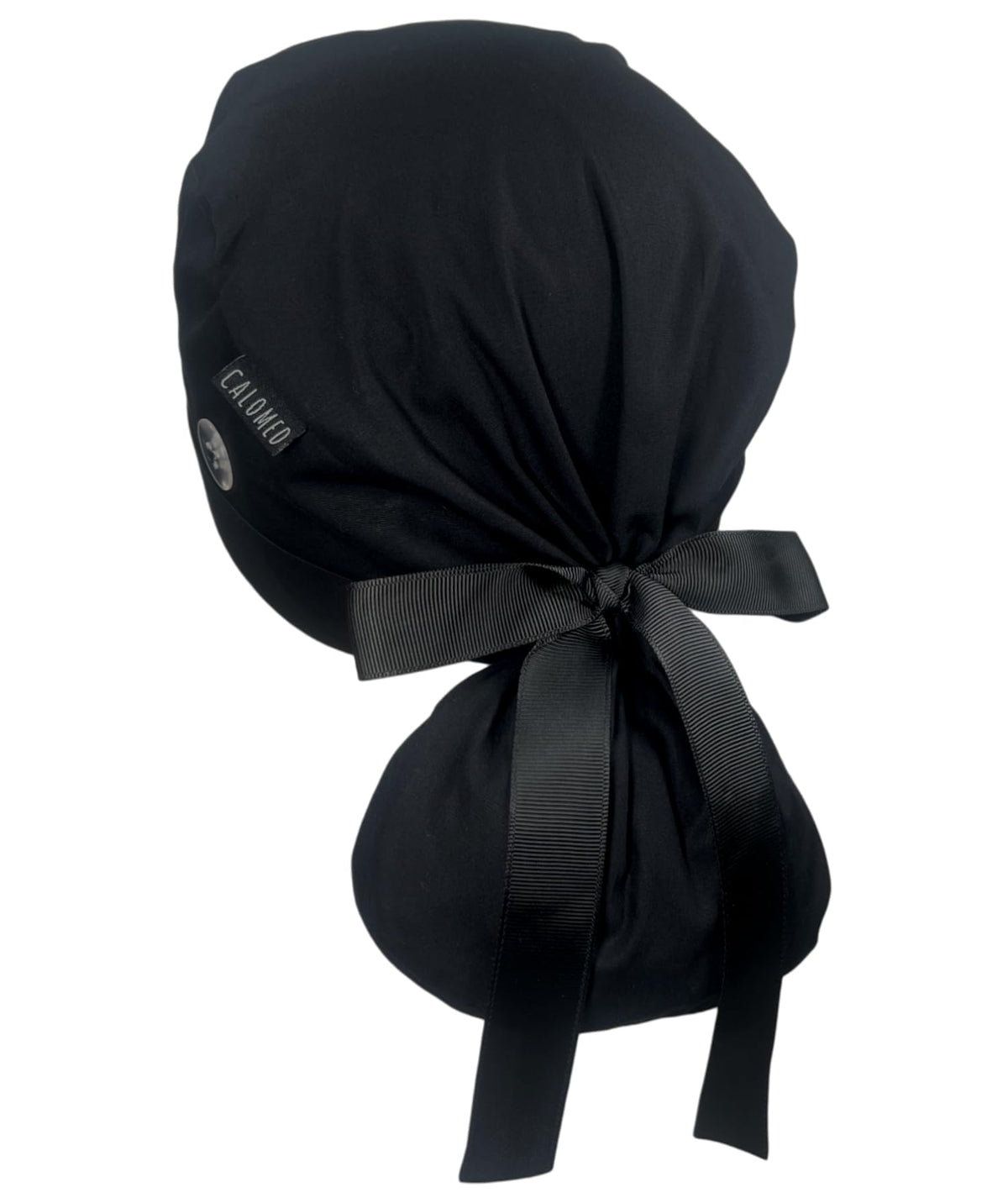 CALOMED front view black ponytail scrub cap showing secure fit and neat ribbon bow