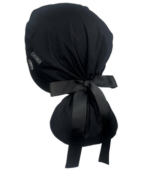 CALOMED front view black ponytail scrub cap showing secure fit and neat ribbon bow