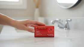 Camay bars on bathroom shelf evoking fragrant, elegant daily routine