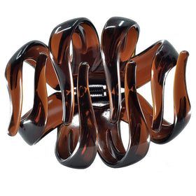 Camila clip holding thick curly hair, prevents slipping all day