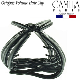 Camila Paris beside a hand for size comparison and portability