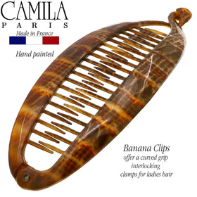 Camila Paris held in hand to show 6.75-inch scale and capacity