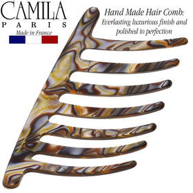 Camila Paris securing a low bun chignon for a neat, long-lasting style