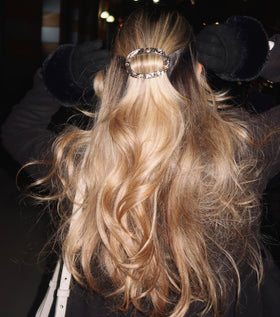 Camila Paris worn in a low bun on model showing effortless, polished styling