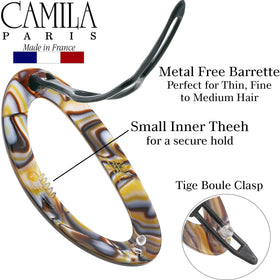 Camila Paris hand-held beside a ruler showing true three-inch size and scale