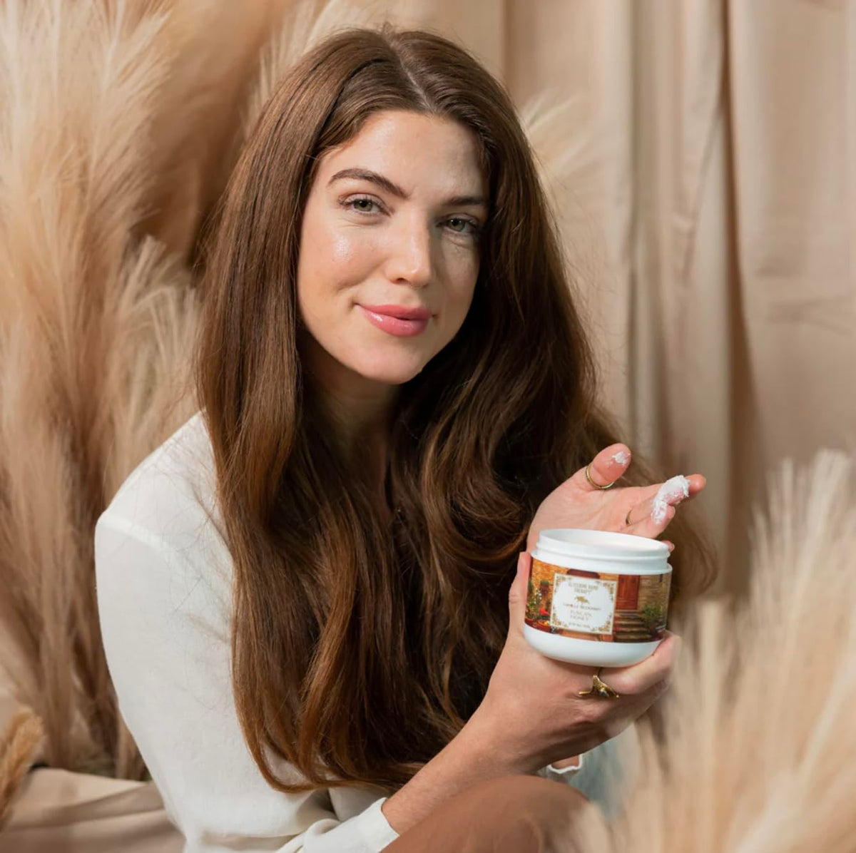 Camille Beckman cream applied to hands demonstrating quick absorption and softness