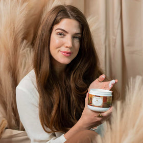 Camille Beckman cream applied to hands demonstrating quick absorption and softness