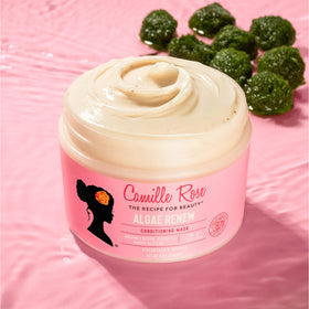 Camille Rose being applied to curly hair for detangling and improved manageability