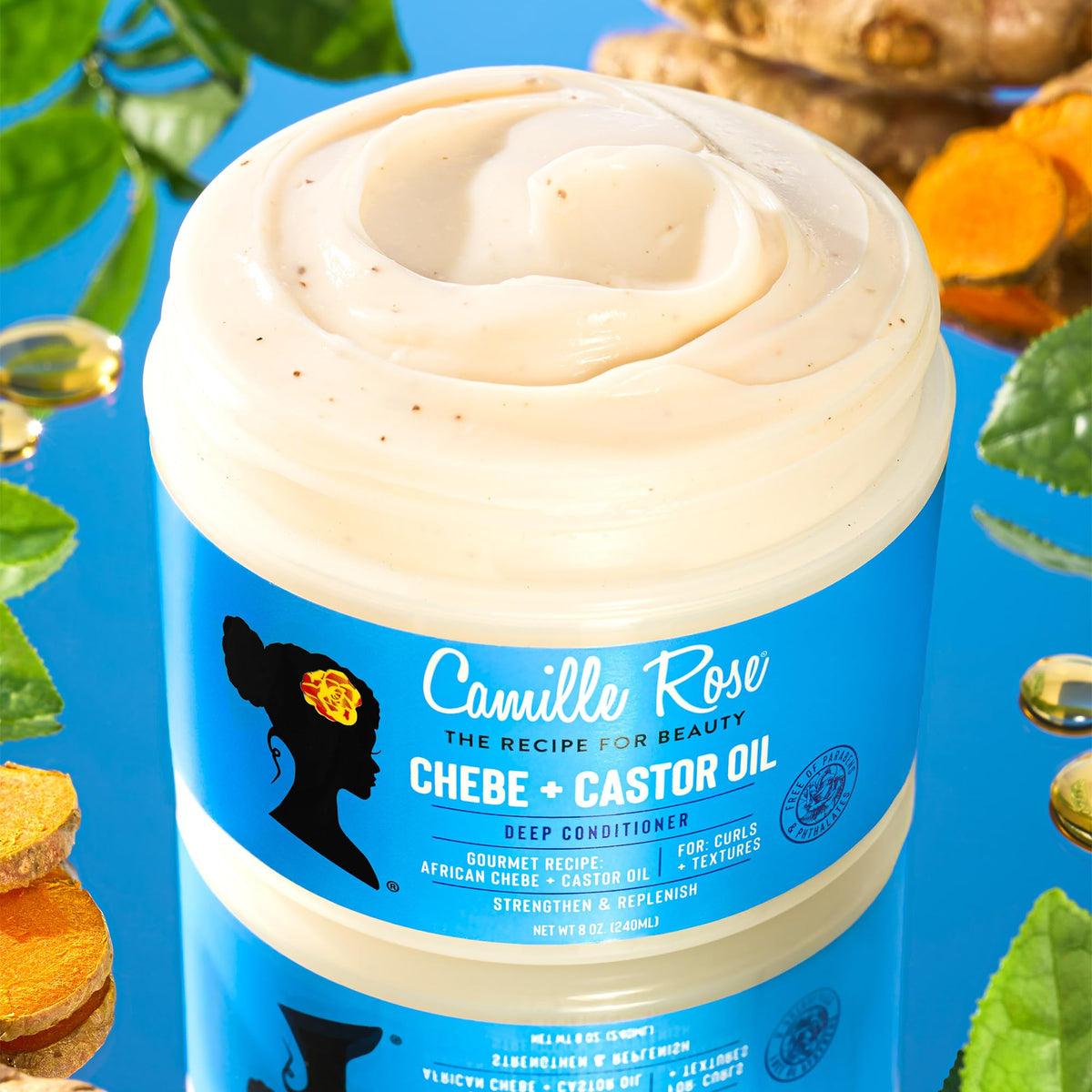 Camille Rose conditioner creamy texture on spoon showing deep slip for detangling