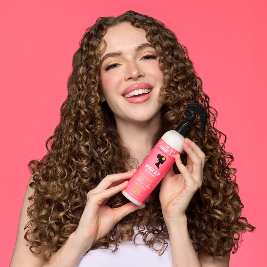 Camille Rose being applied to wet hair demonstrating quick glide and reduced pulling