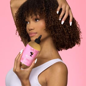 Camille Rose in-bathroom use showing application and refreshed scalp benefit