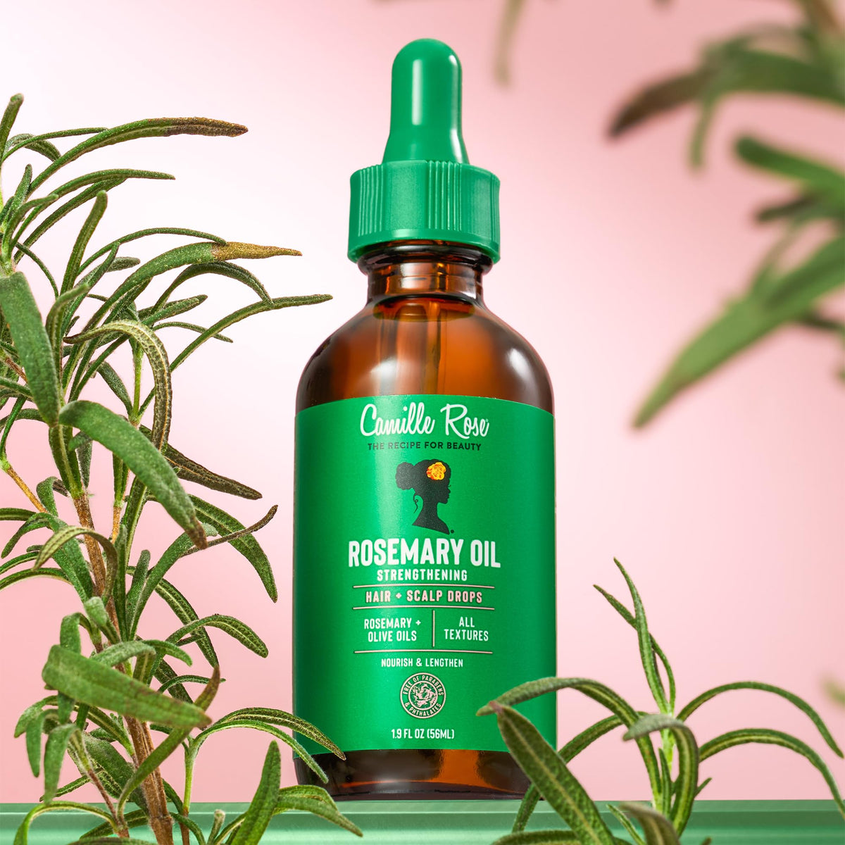 Camille Rose oil being massaged into scalp demonstrating improved circulation and care