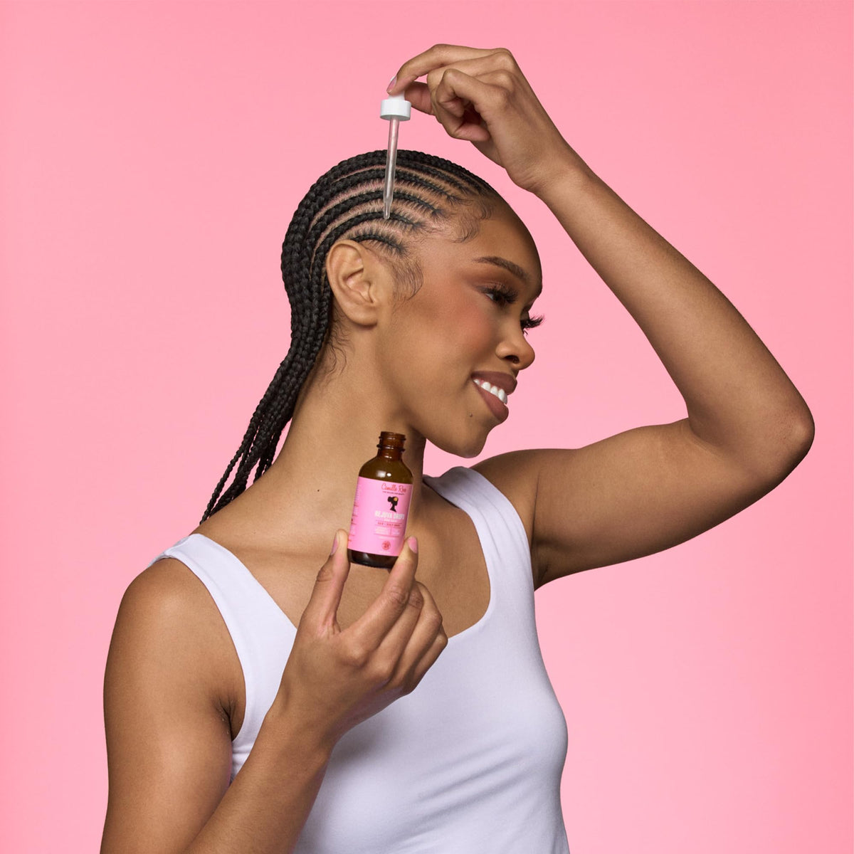 Camille Rose serum applied to scalp demonstrating targeted nourishment