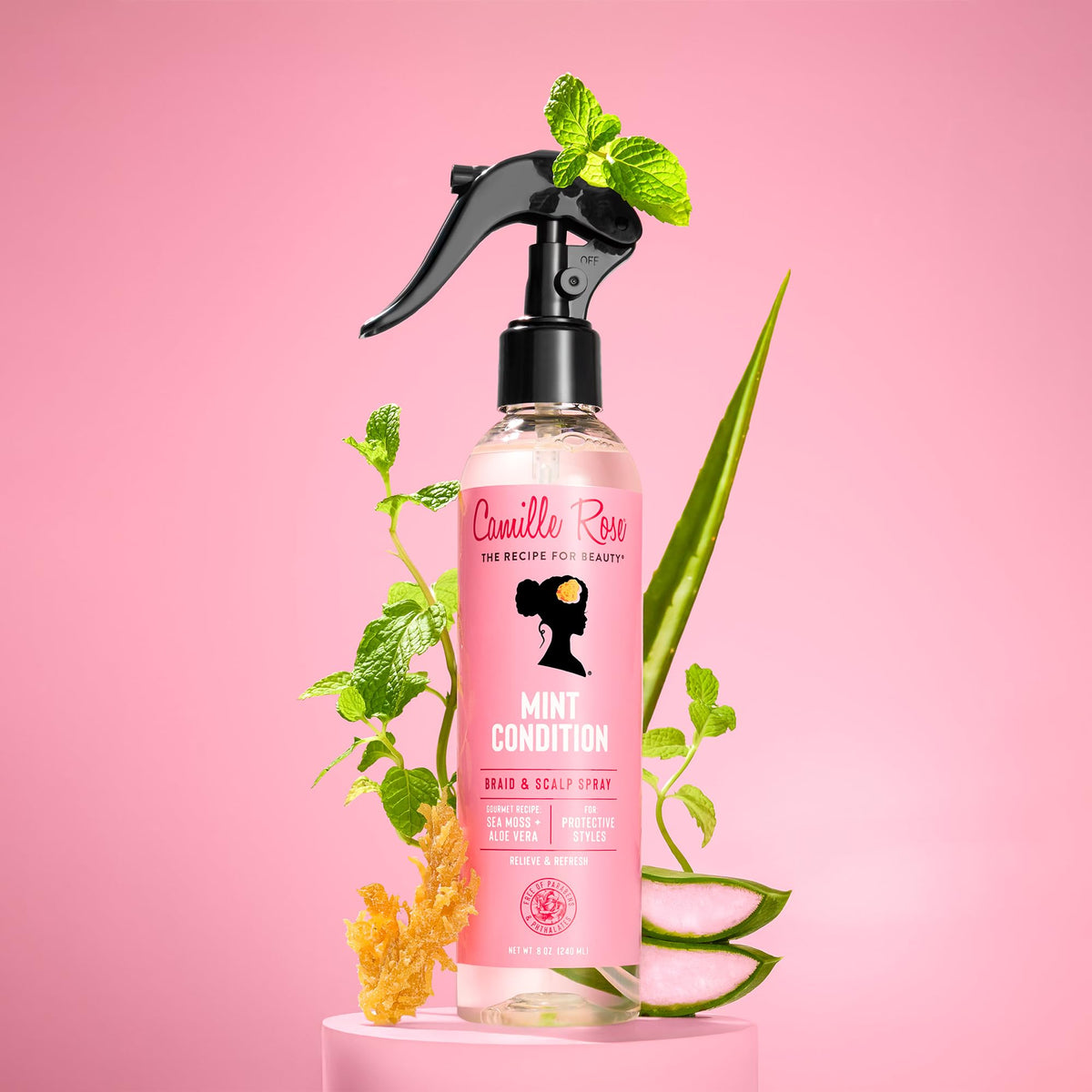 Camille Rose misting on braids showing lightweight texture and instant refresh
