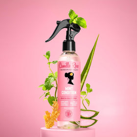 Camille Rose misting on braids showing lightweight texture and instant refresh