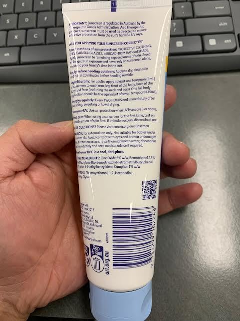 Cancer Council applying sunscreen to arm demonstrating easy spread and soothing benefit