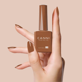 CANNI soft nude tone on model hand, natural polished finish benefit