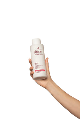 Cantabria Labs IRALTONE applied in shower demonstrating scalp massage benefit