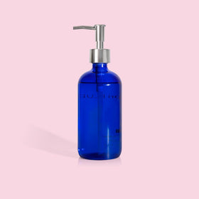 Capri Blue bottle bathroom shelf styled scene adding fragrance and visual appeal