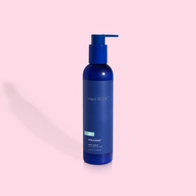 Capri Blue serum on bathroom vanity lifestyle scene creating a scented self-care moment