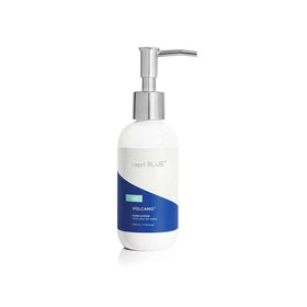 Capri Blue front pump bottle showing sleek white packaging and easy dispensing benefit