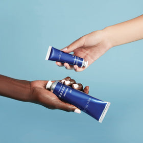 Capri Blue close-up of shea butter and jojoba oil highlighting nourishing ingredients