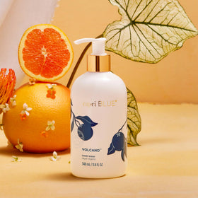 Capri Blue label detail with vibrant Flora Edit artwork, highlights fragrance identity