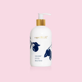 Capri Blue refill pouring into bottle, supports sustainable reuse and reduced waste