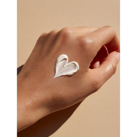 Person applying Care hand cream demonstrating quick absorption and protected hands