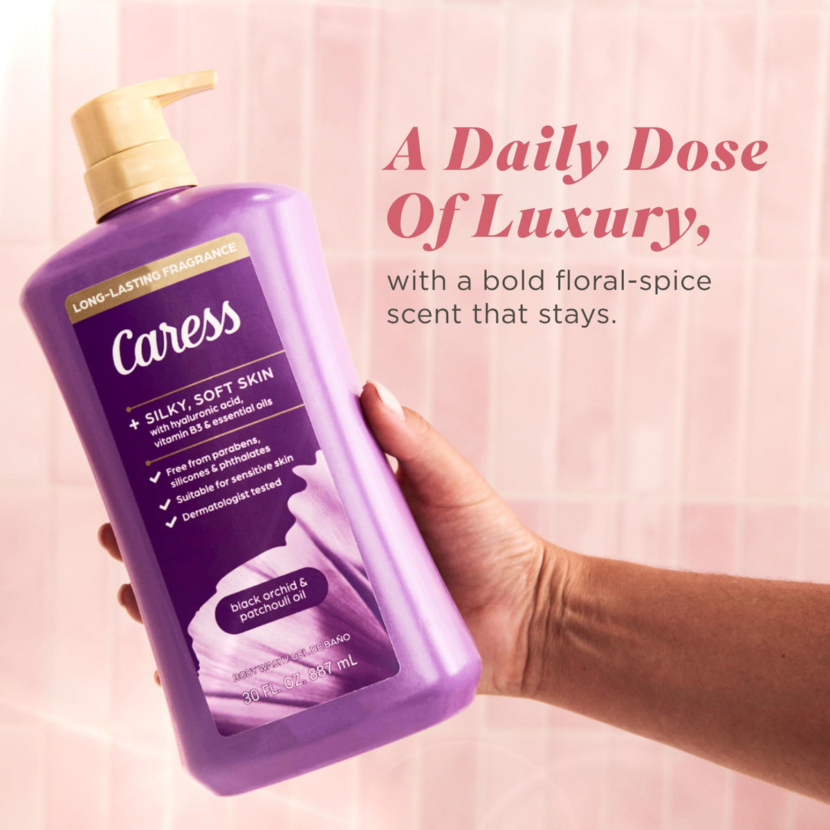 Caress bottle next to hand to show 30 fl oz size