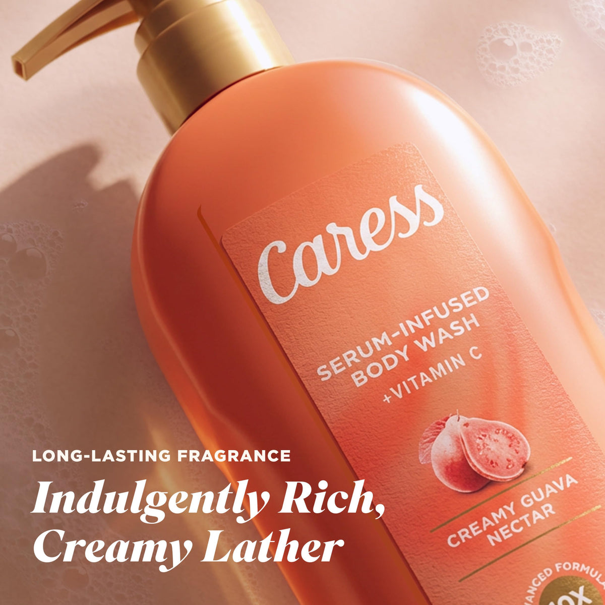 Caress bottle held in hand to show 20 fl oz scale and convenient pump size for showers