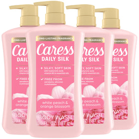 Caress bottle front packaging showing white peach and orange blossom fragrance benefit