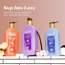 Four Caress bottles stacked to show 4-pack convenience and supply benefit