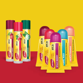 Carmex full-size stick strawberry close-up showing smooth application