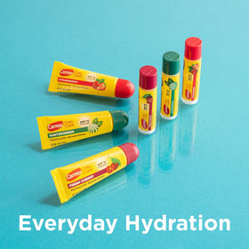 Carmex in hand for scale showing portability and everyday convenience